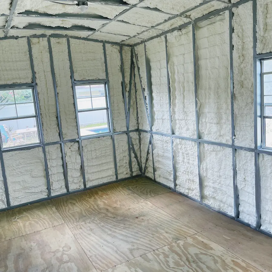 Closed-cell spray foam insulation applied to wall cavities in a residential project in Arkadelphia